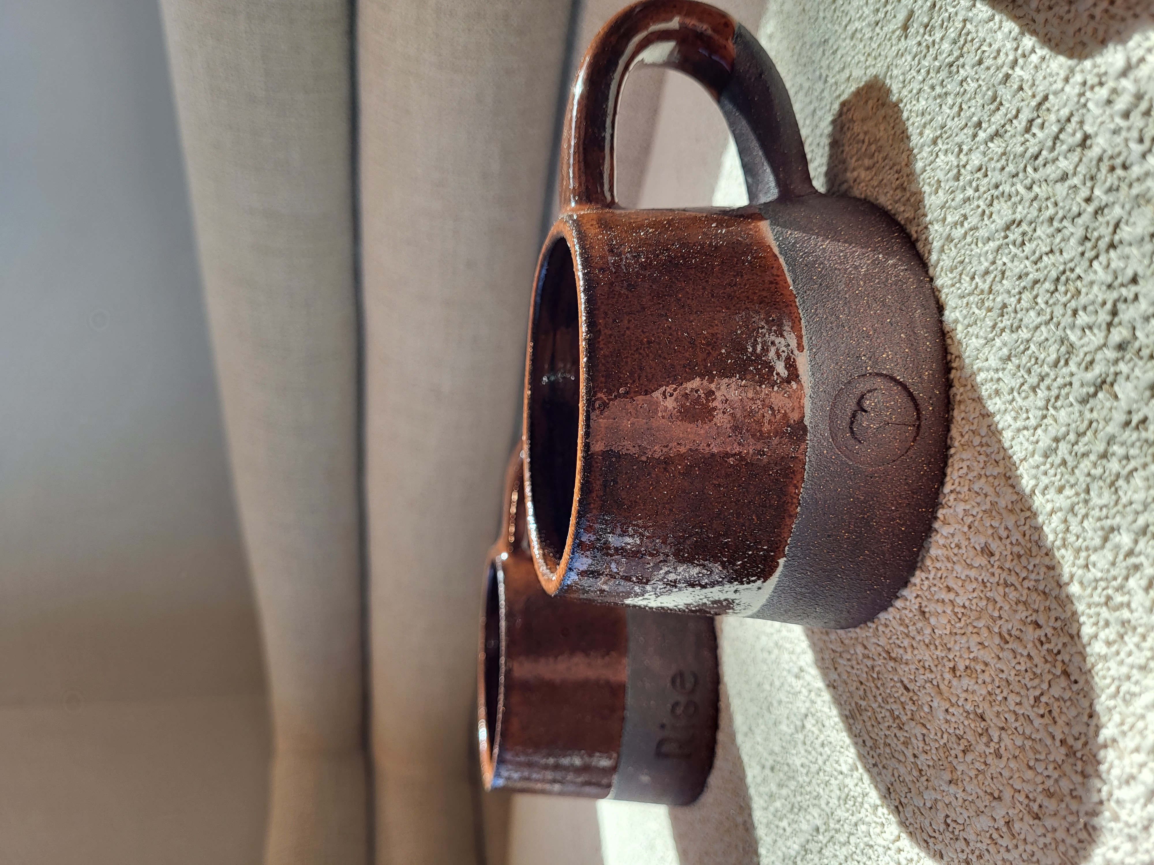 Rise Dental hospitality detail with brown mugs